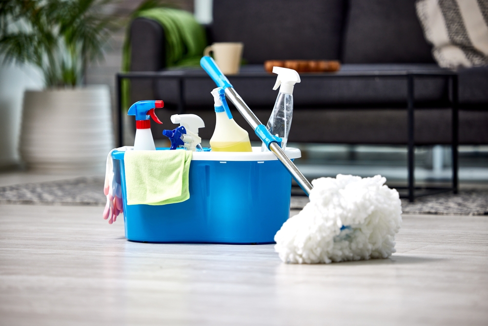Cleaning,,Detergent,And,Mop,On,The,Floor,Of,A,Living